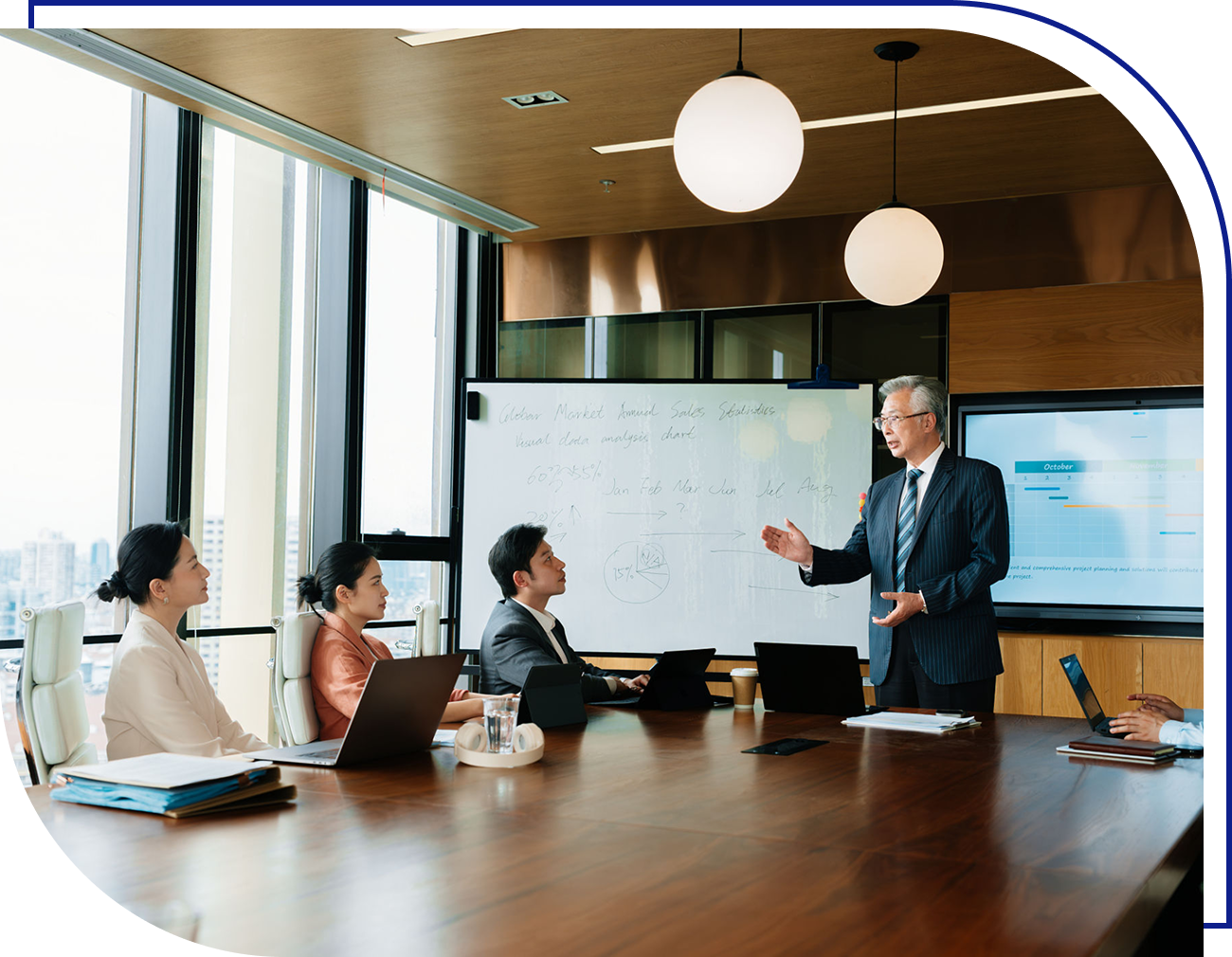 Business meeting in modern conference room.