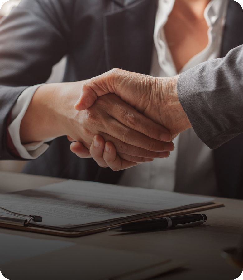 Business handshake over a contract agreement.